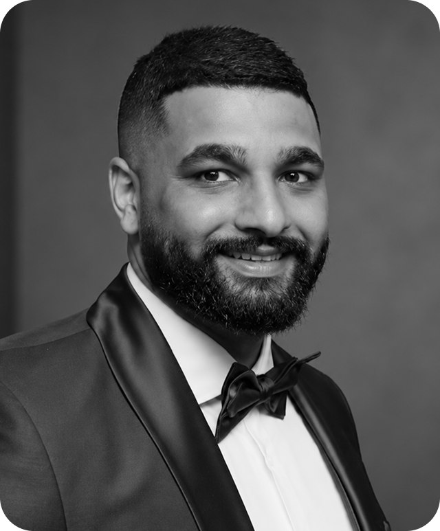 Black and white headshot of Jas Singh