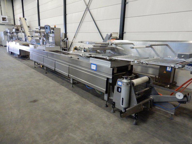 Thermoforming packaging machine for dairy and food production applications
