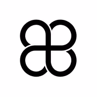Abstract black emblem resembling a symmetrical clover or butterfly formed by four connected loops.
