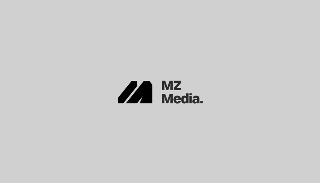 White stylized Munity logo with star icon on black background with blue and purple lights.