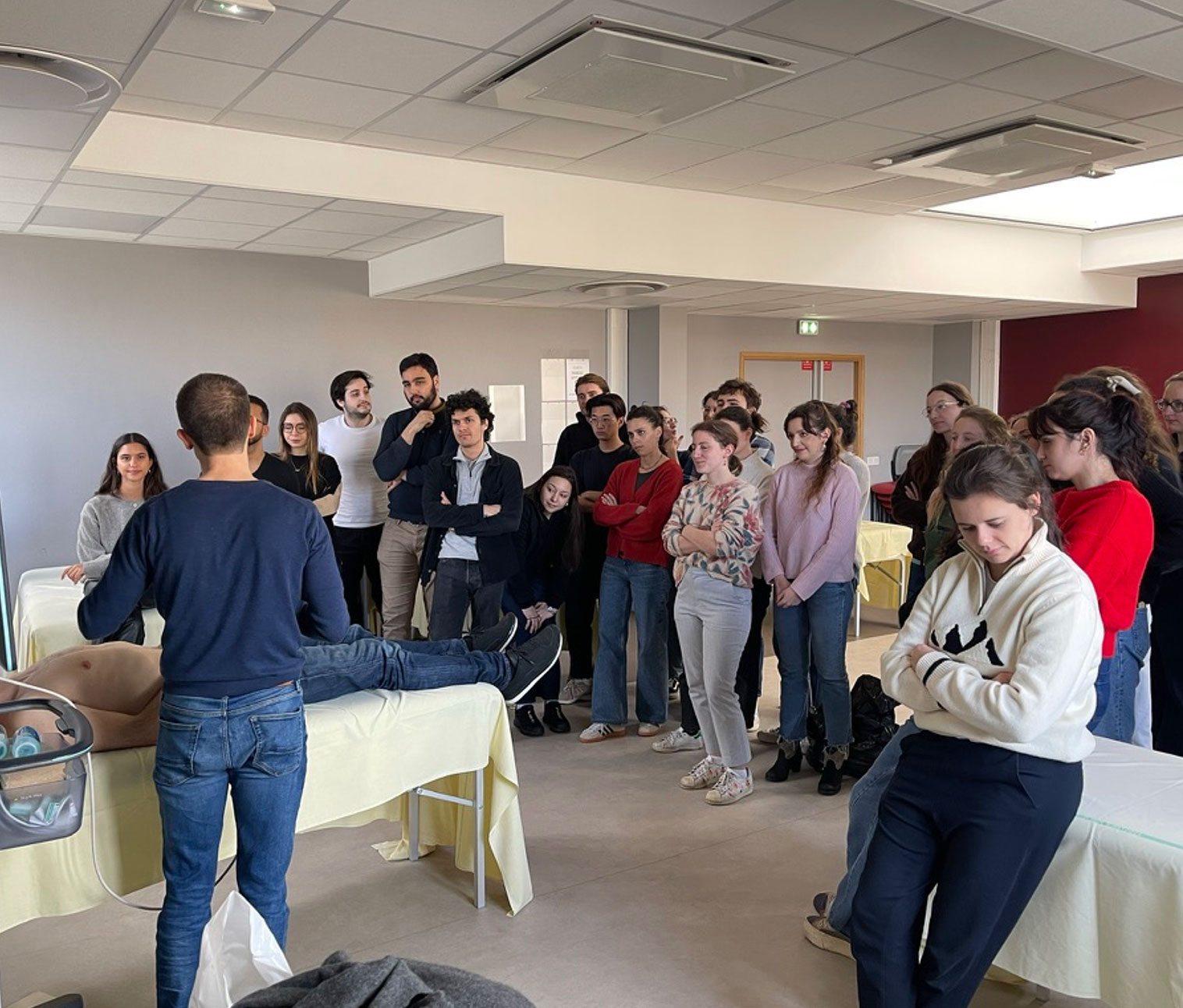 An X-ray image of a hand making an ‘OK’ gesture, showing detailed bone structure.