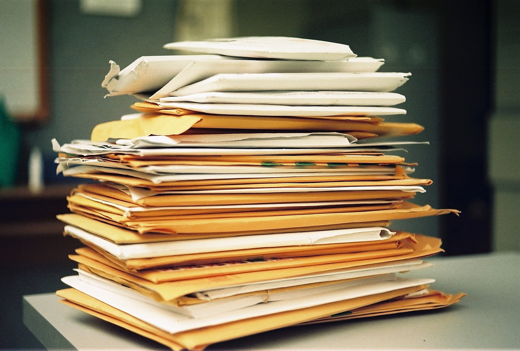 a stack of patient charts and forms