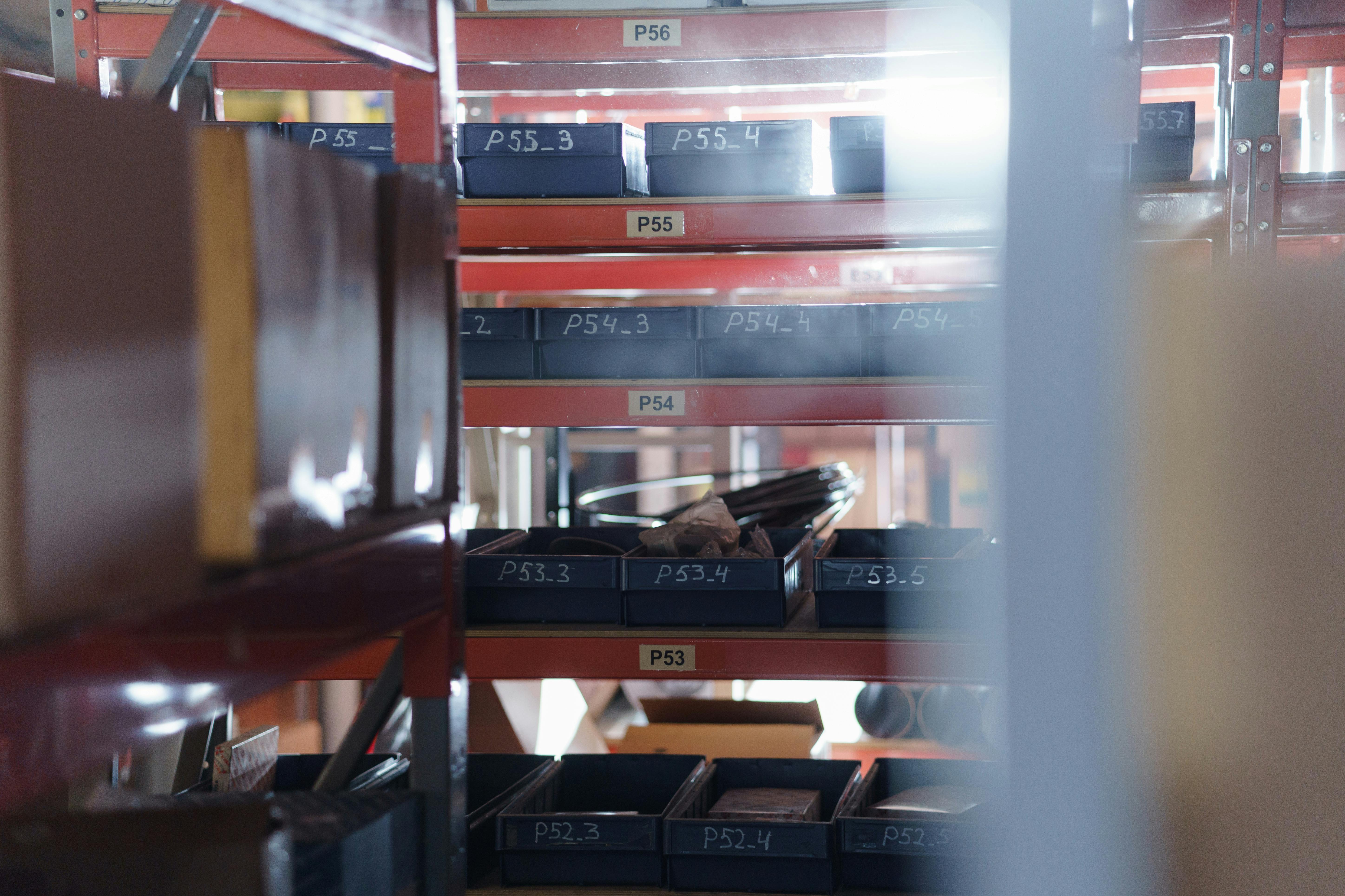 A well-organized warehouse shelving unit with numbered bins for efficient storage and inventory management.