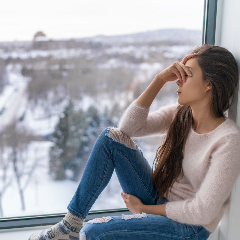 woman sitting by the window