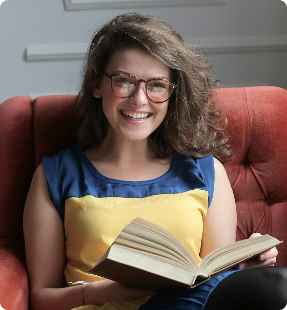 Smiling woman reading a book