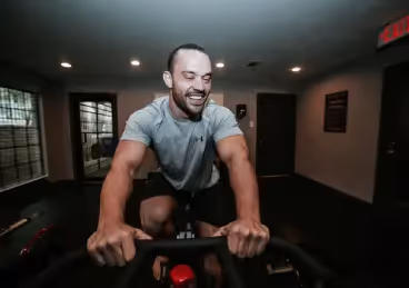 Man rides a stationary bike