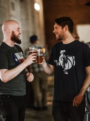 Two friends drinking a beer together