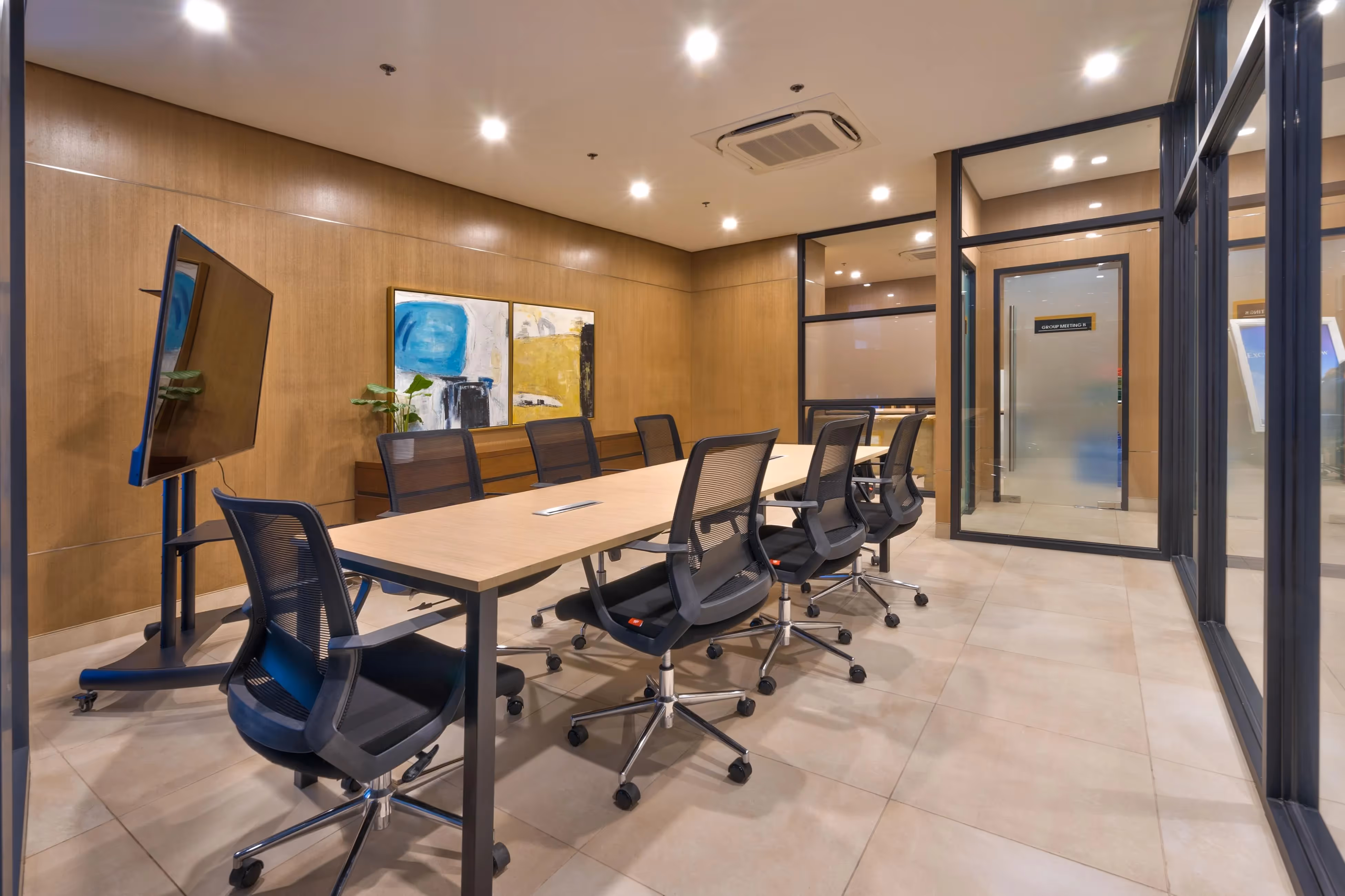 Modern conference room with large glass windows and executive seating at 3Torre Lorenzo.