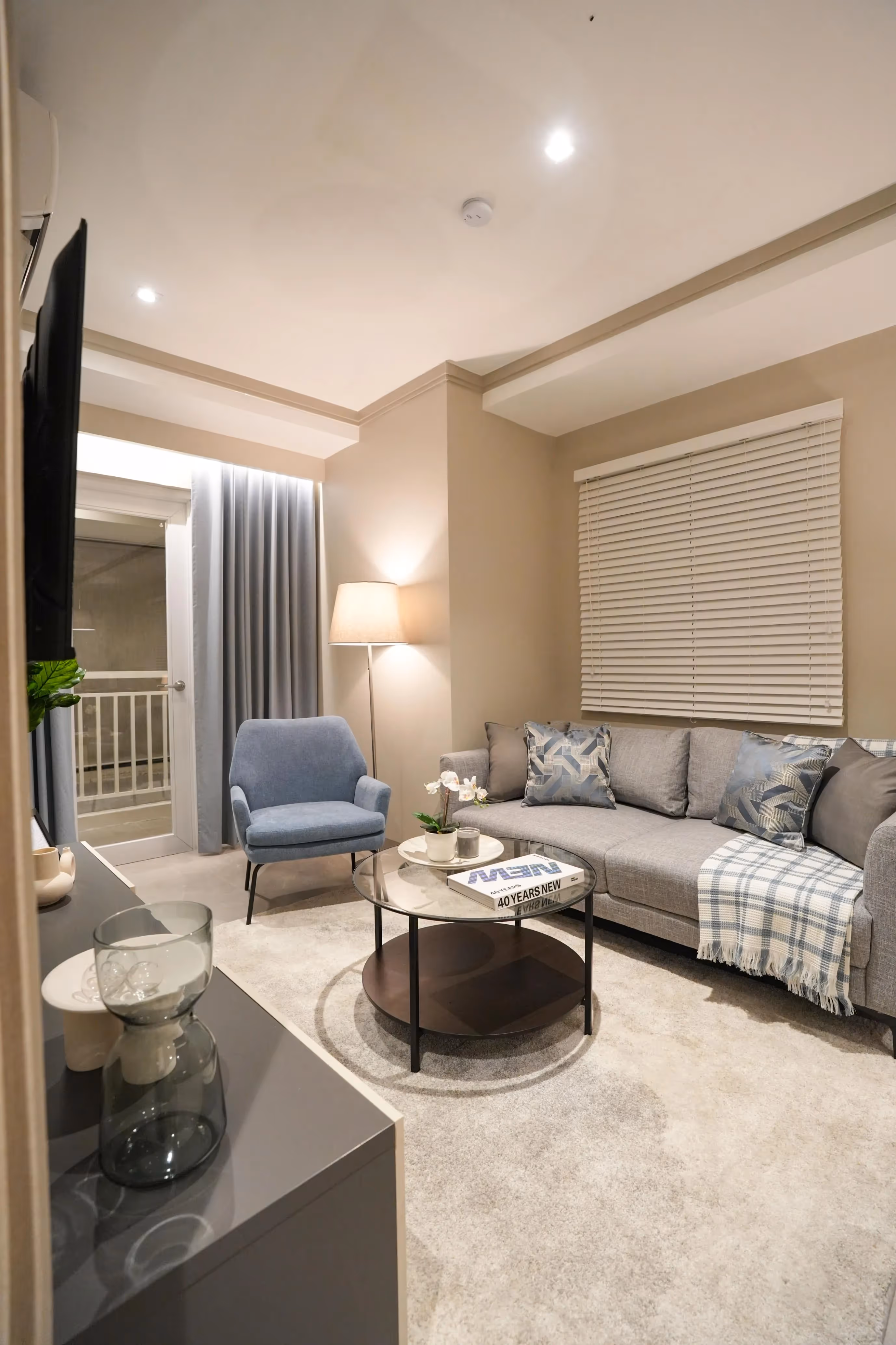 Stylish condo hallway with wood paneling and ambient lighting.