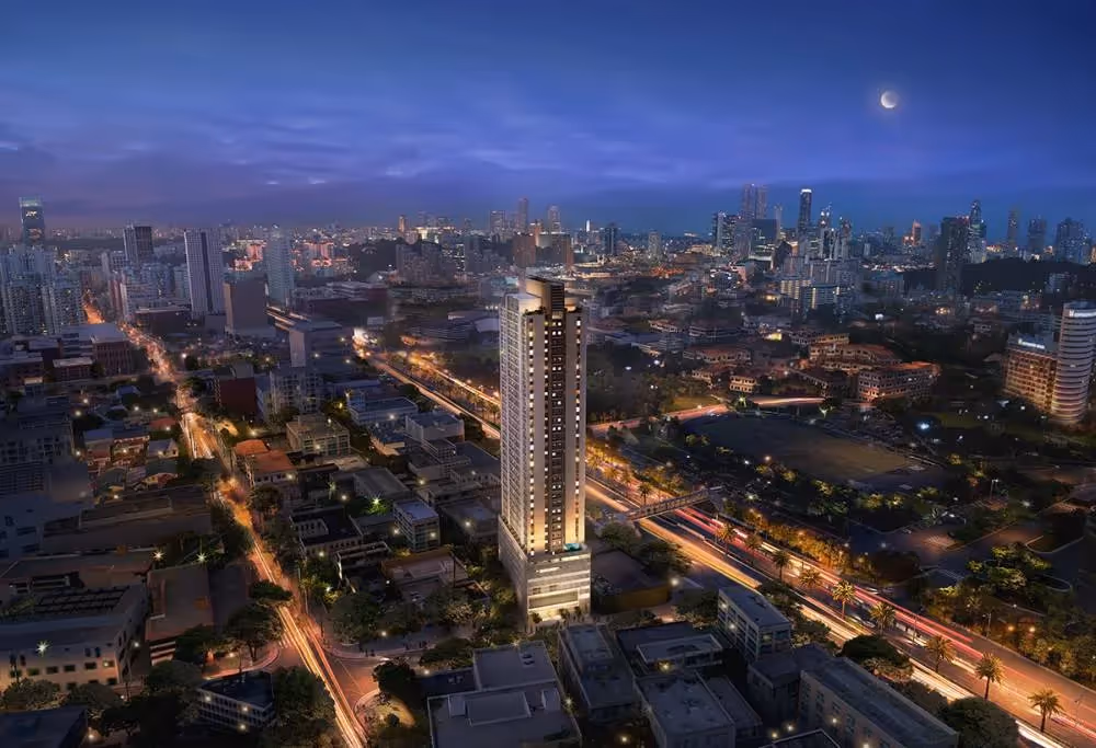 Modern cityscape at night with high-rise tower