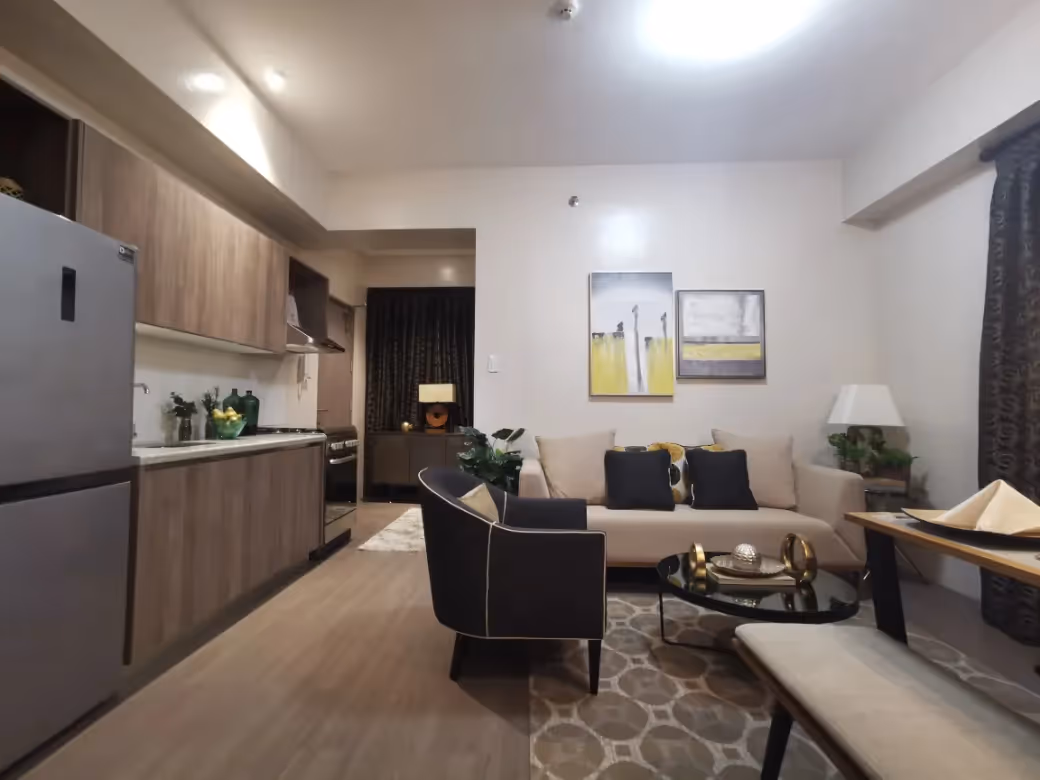 Modern Adria unit open-plan kitchen and living area with neutral tones at Adria.