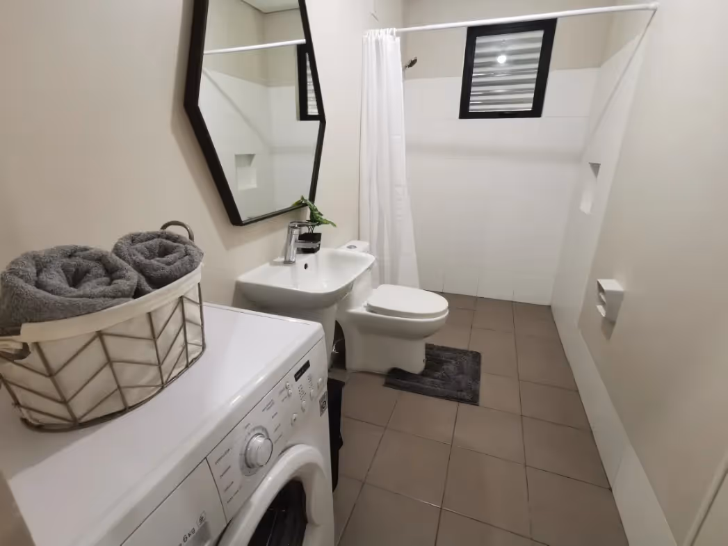 Clean and compact Adria unit bathroom with modern fixtures at Adria.