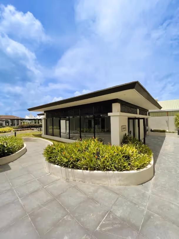 Clubhouse exterior with landscaped circular driveway