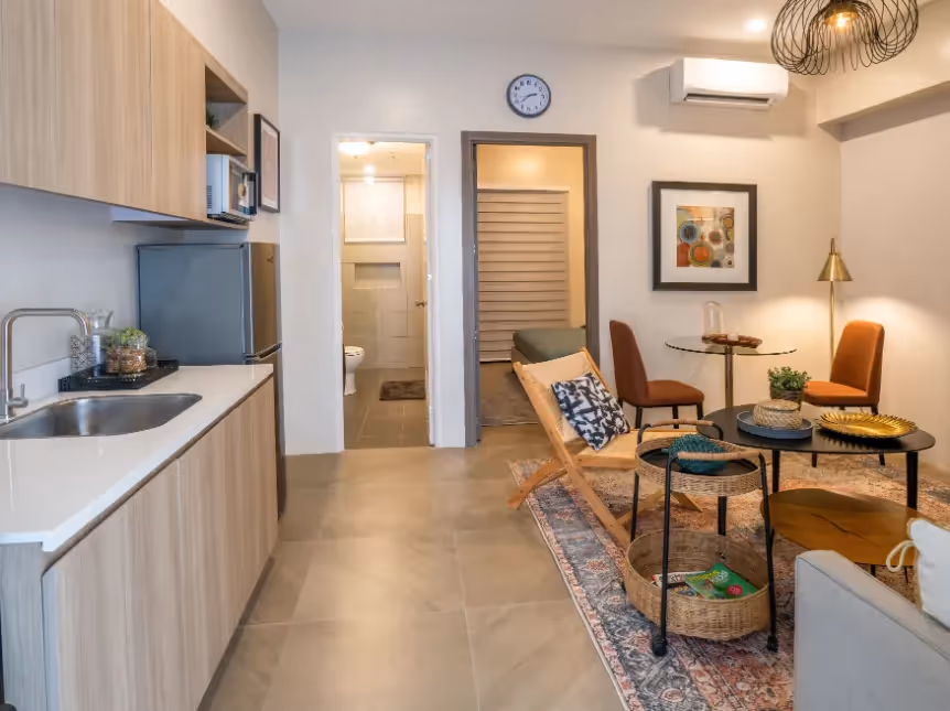 Spacious one-bedroom unit with open dining, living, and kitchen areas at Merano, Tierra Lorenzo Lipa.