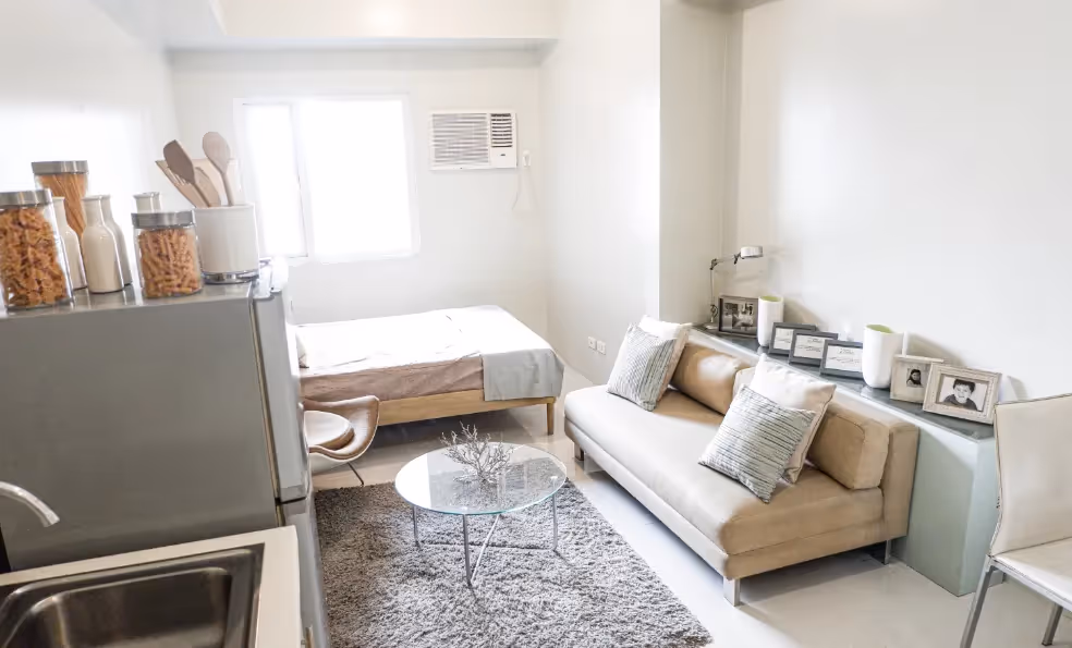 Compact living space with armchairs and minimalist decor at 2Torre Lorenzo.