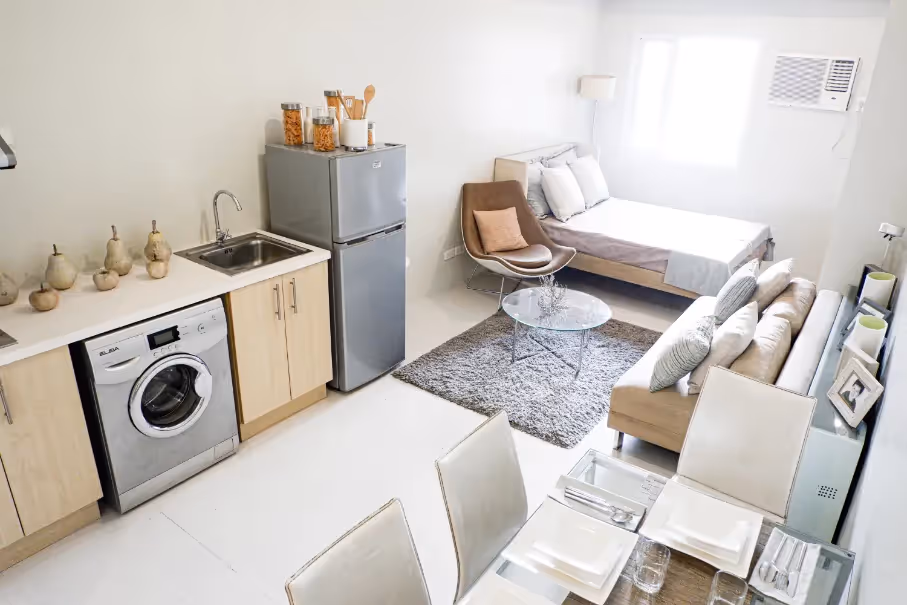 Functional studio unit combining living, dining, and kitchen spaces at 2Torre Lorenzo.