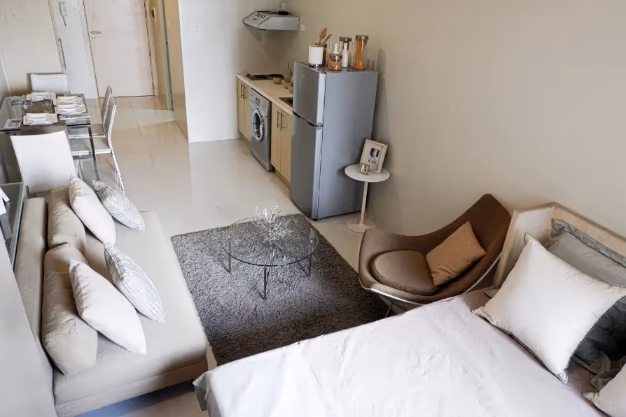 Open-plan living area with modern kitchen appliances and bright interiors at 2Torre Lorenzo.