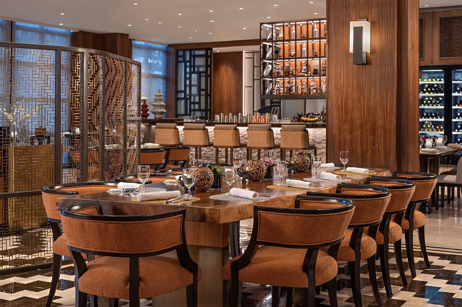 Elegant dining area set for evening service with warm tones at dusitD2 Davao.