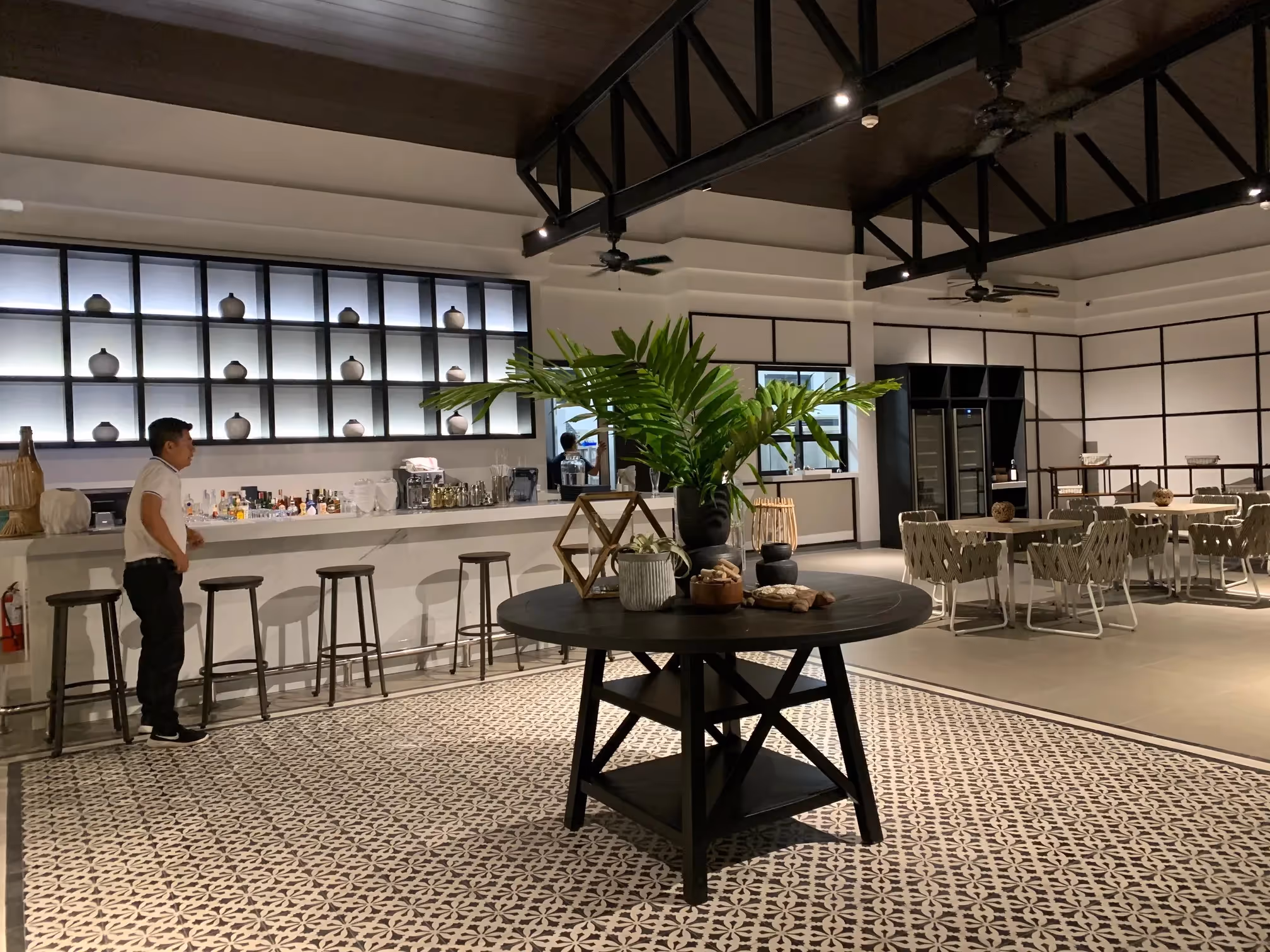 Chic resort bar area with modern furnishings at Dusit Thani Lubi Plantation Resort.