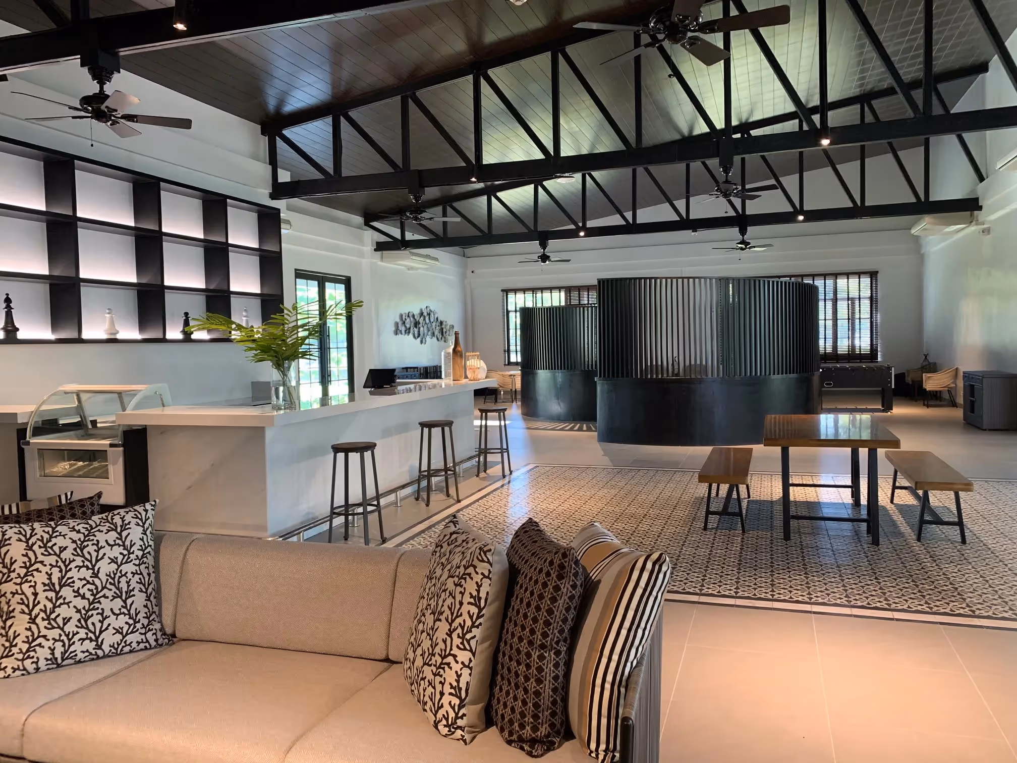 Luxury resort lounge with elegant seating and high ceilings at Dusit Thani Lubi Plantation Resort.