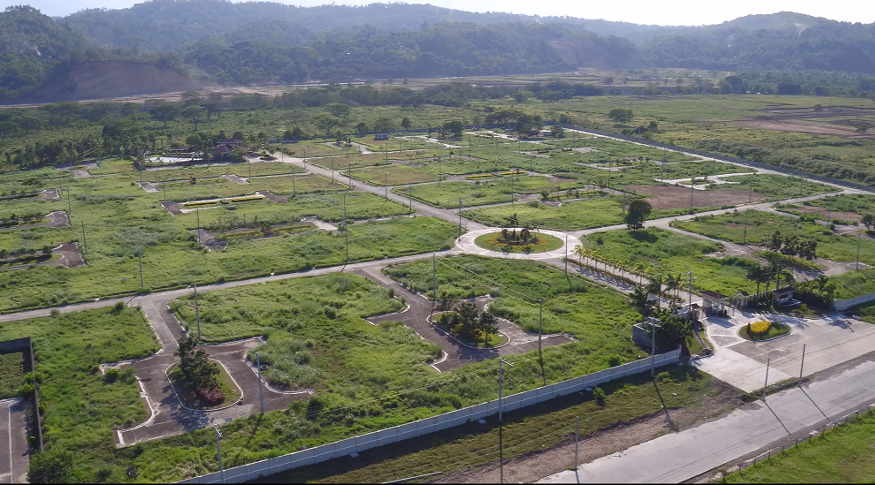 Exterior view of Nizanta residential complex with contemporary design and green landscaping.