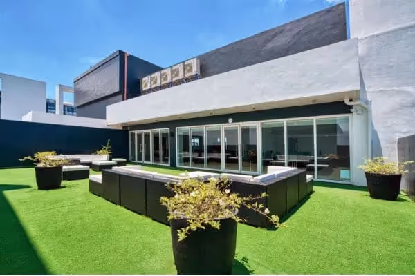 TLDC outdoor lounge area with artificial grass