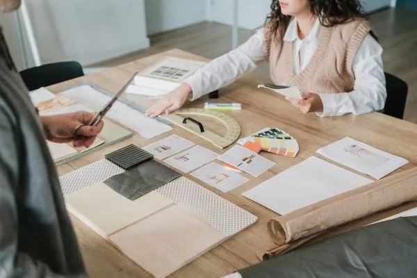 Interior designers collaborating with fabric swatches and samples