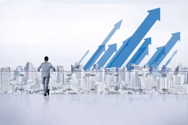Businessman overlooking city skyline with upward growth arrows illustration