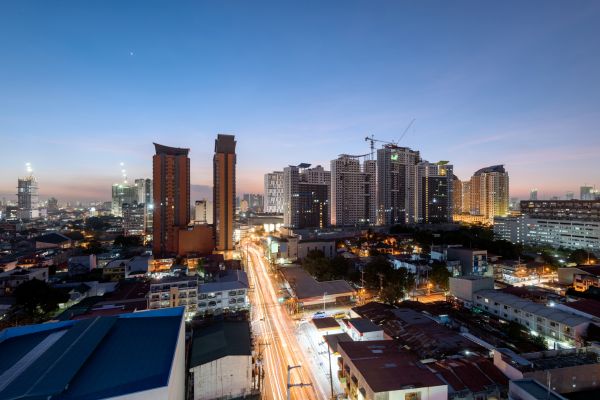 City skyline with light trails at dusk