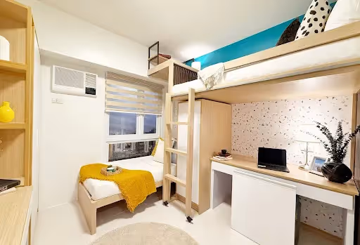 Loft bedroom with study desk and bunk bed in modern small apartment