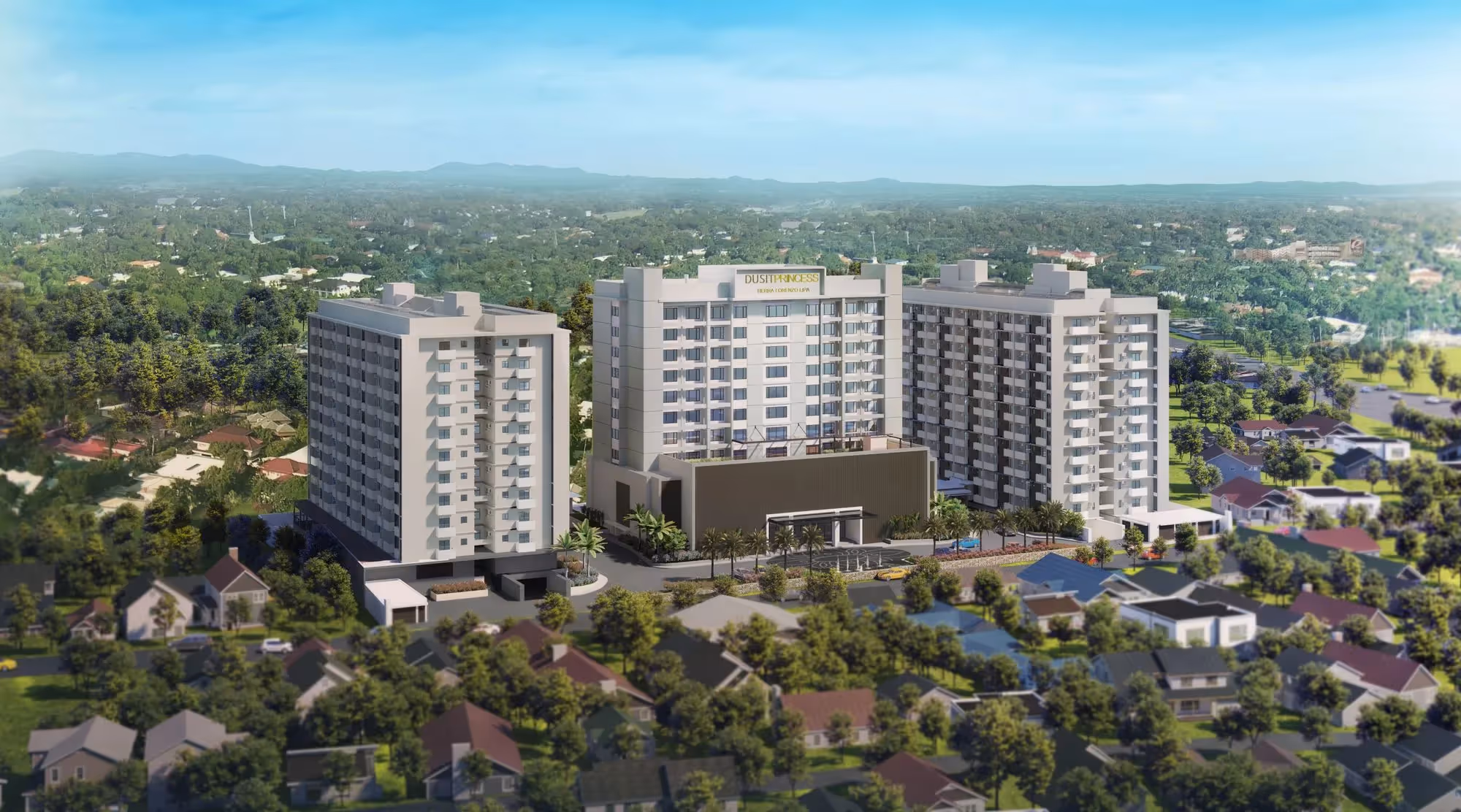 Modern condominium complex surrounded by residential houses and greenery.