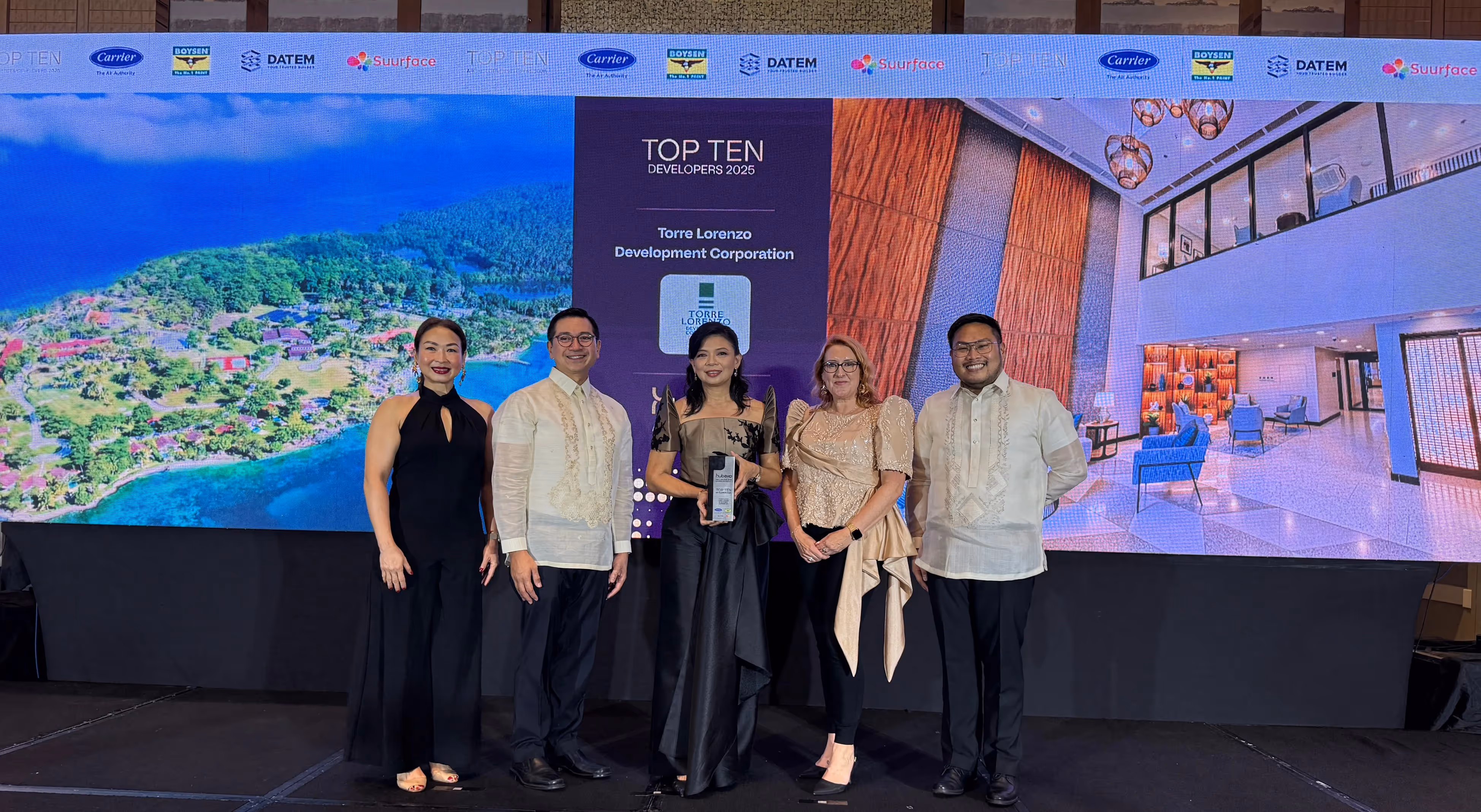 Team receiving Best Hotel Interior Design award on stage at gala event