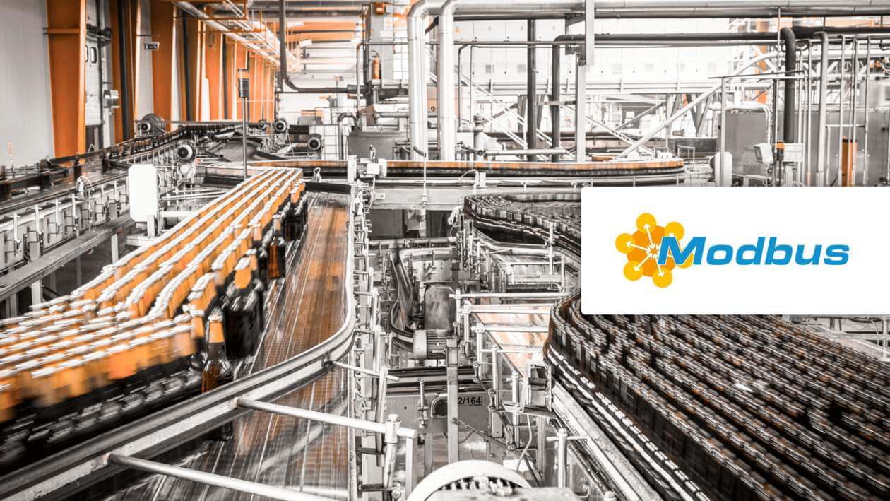 Close-up of Modbus RTU sensors with terminal blocks and serial cable connections on industrial control hardware