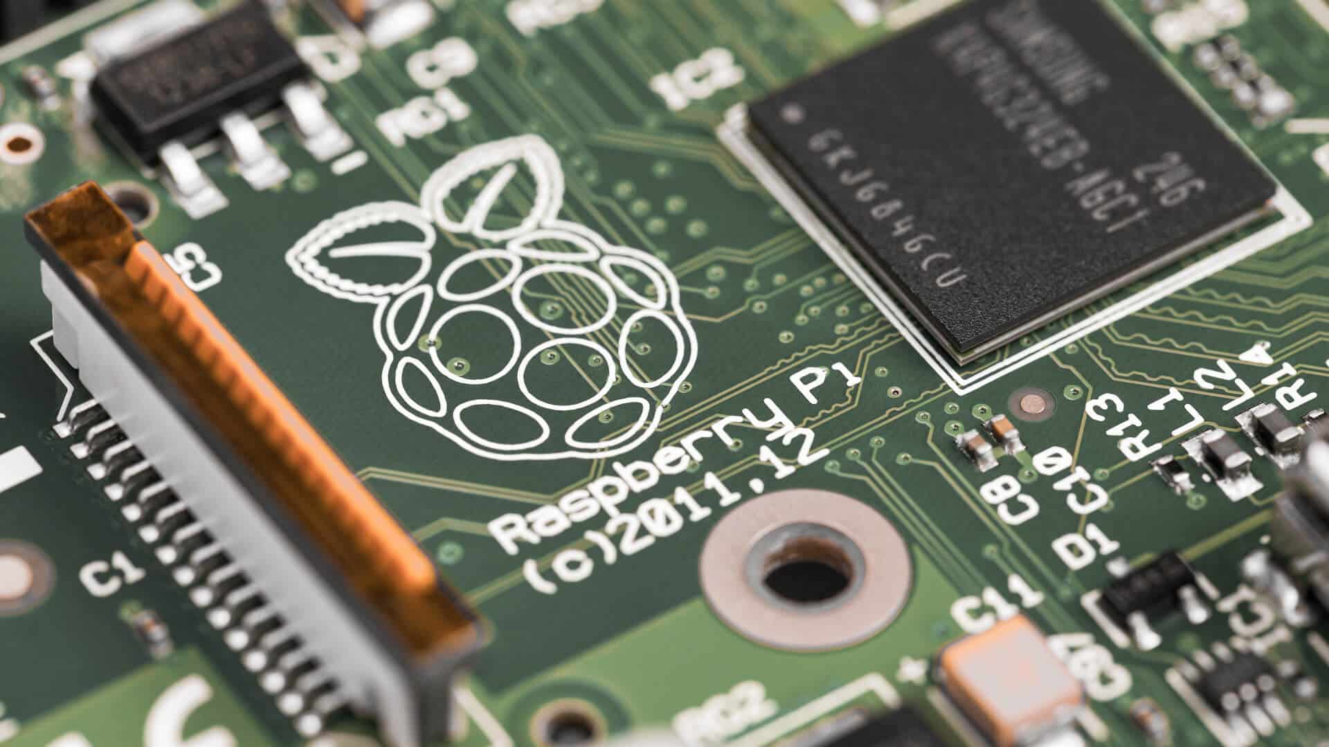 Close-up of a modern card payment terminal with touchscreen, chip-and-PIN slot and contactless symbol on a wooden counter