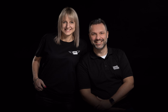 Smiling diverse team of colleagues collaborating around a table in a bright modern office