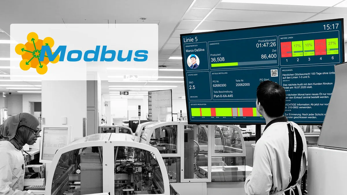 Produktionsmitarbeiter betrachten ein Dashboard mit Echtzeitdaten aus einer Modbus-Anlage – visualisiert mit Peakboard zur Überwachung von Linienstatus und Produktionskennzahlen.
