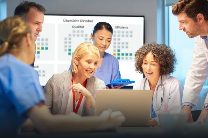 Digital dashboard displaying lean hospital KPIs on a monitor in a clinical ward