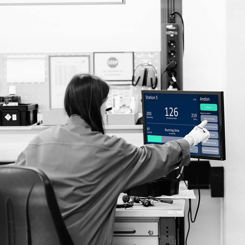 Peakboard touch Andon system terminal on the production floor allowing workers to report issues.