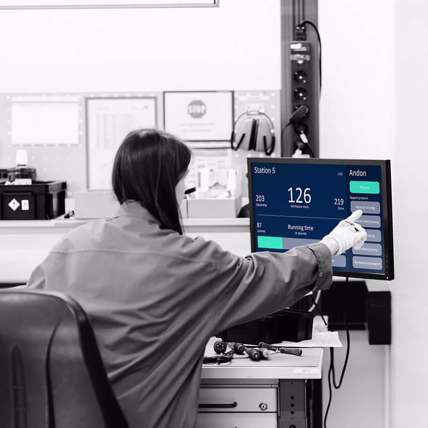 Peakboard touch Andon system terminal on the production floor allowing workers to report issues.