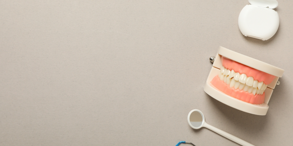 Close-up of dental accessories including mirror, probe, and scaler used by a dentist in Busselton during routine examination and treatment