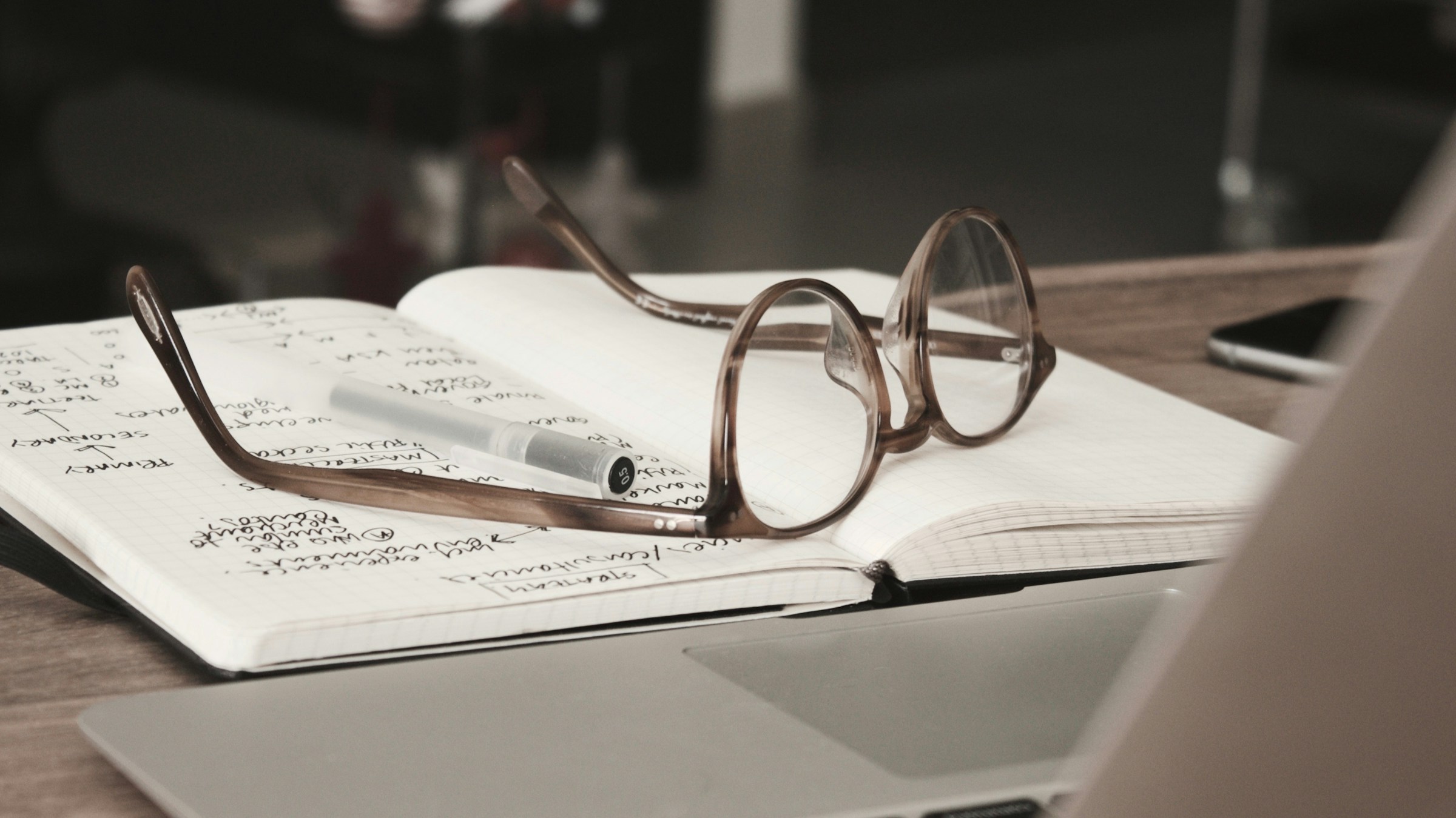 notebook and glasses