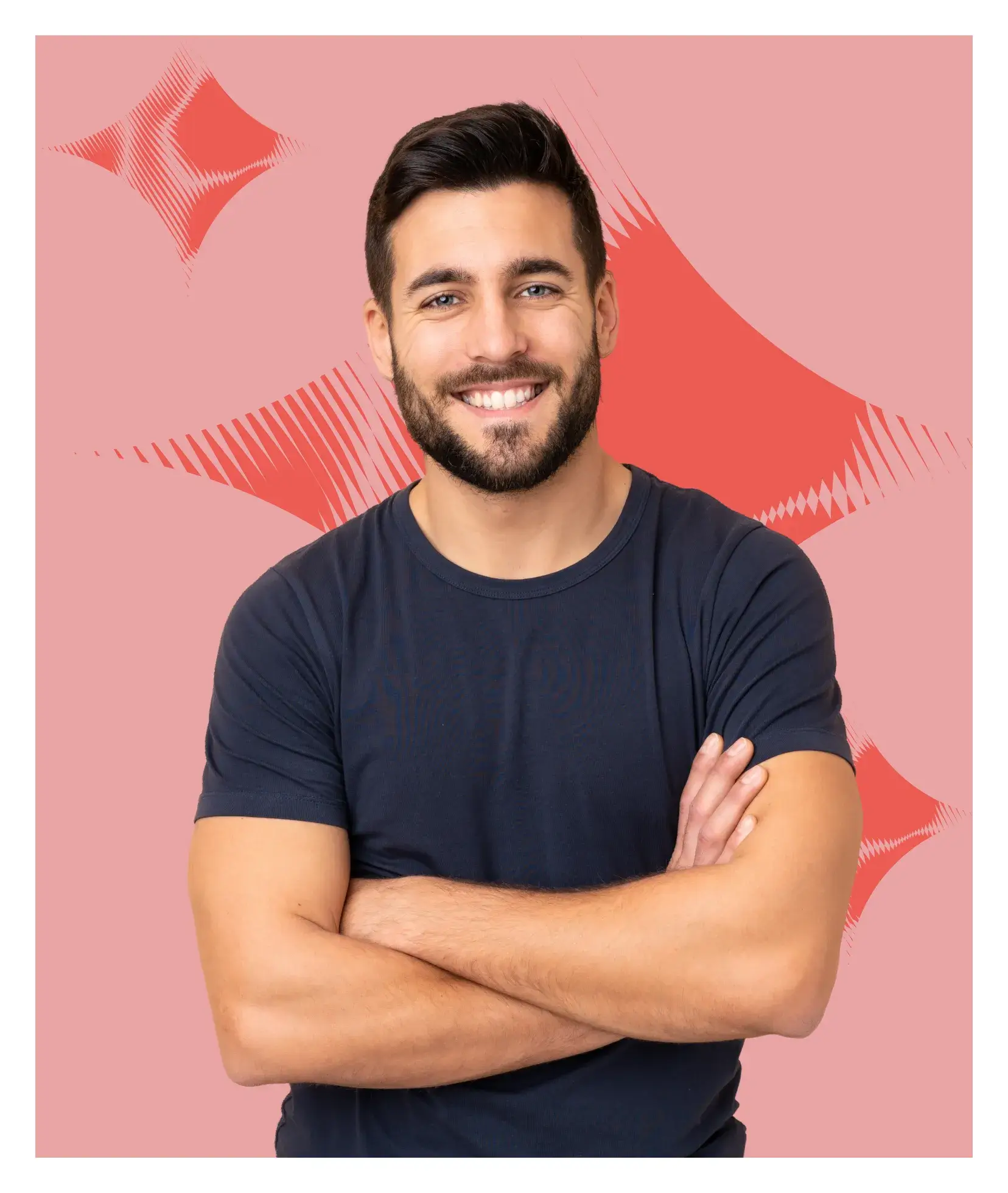 A smiling man with his arms crossed.
