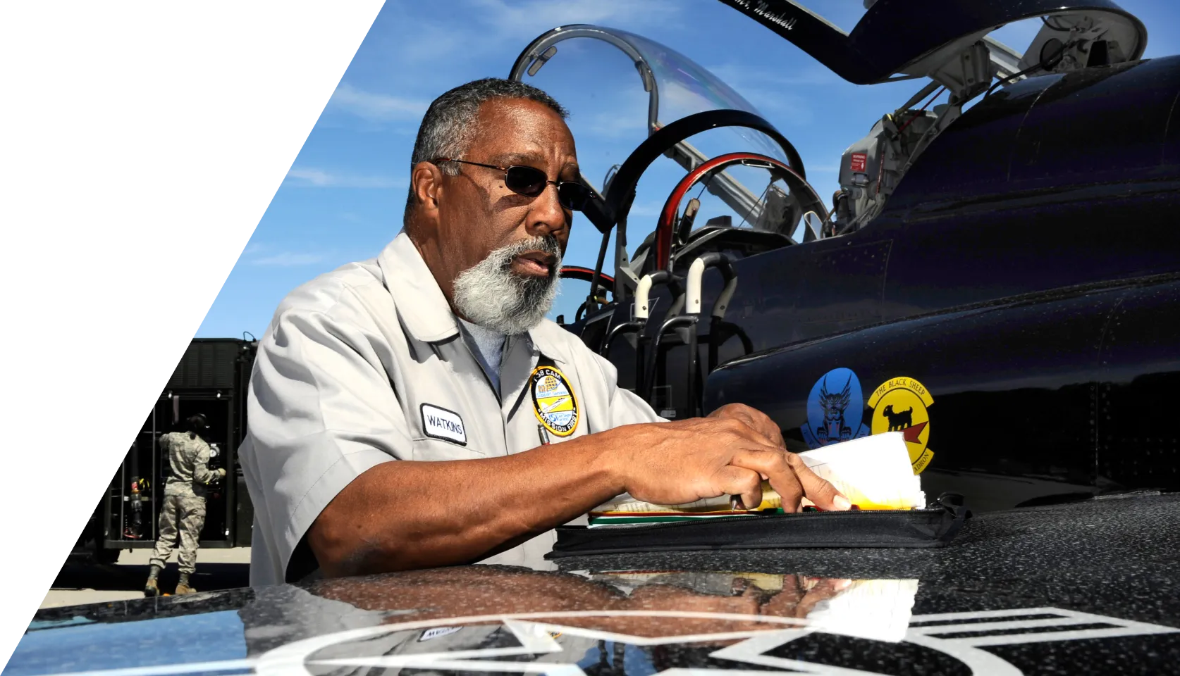 Detailed view of a tech performing maintenance on an aircraft