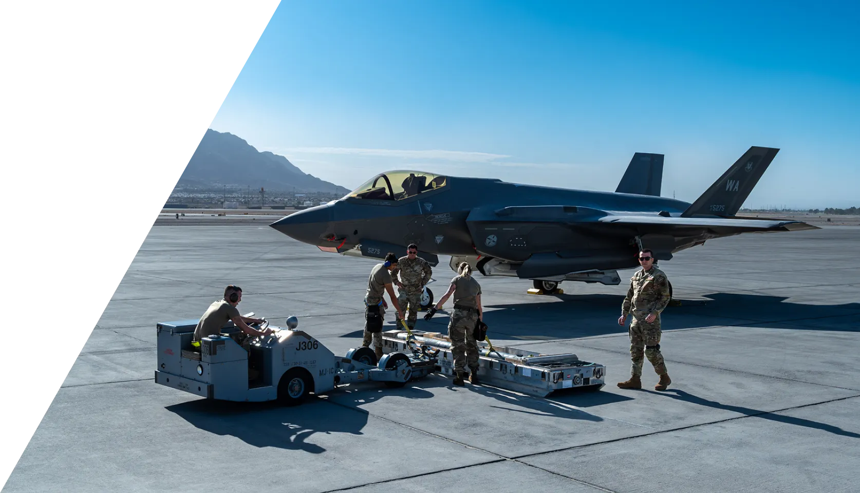 Several technicians performing inspections and repairs on a military jet