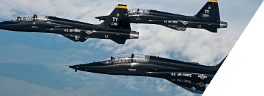Three military aircraft in flight formation
