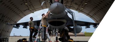 Group of technical personnel servicing an aircraft on the tarmac
