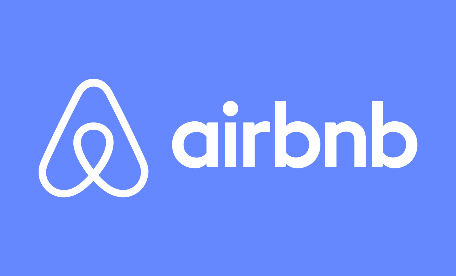 White Airbnb logo on a pink background