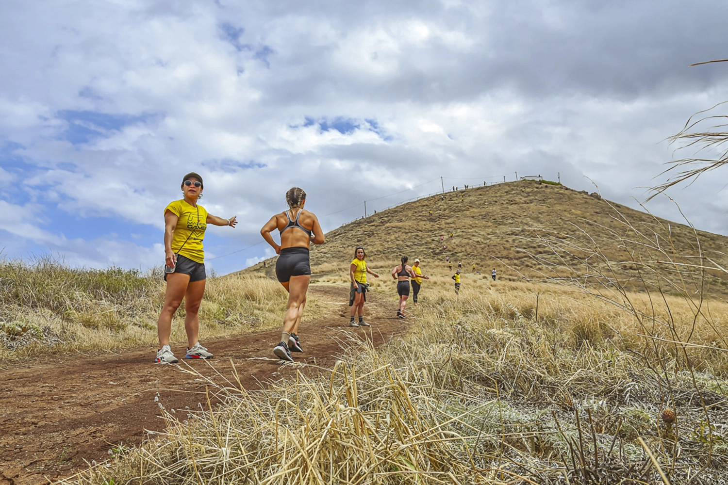 A group of women running up a hill, during the Madeira Games.