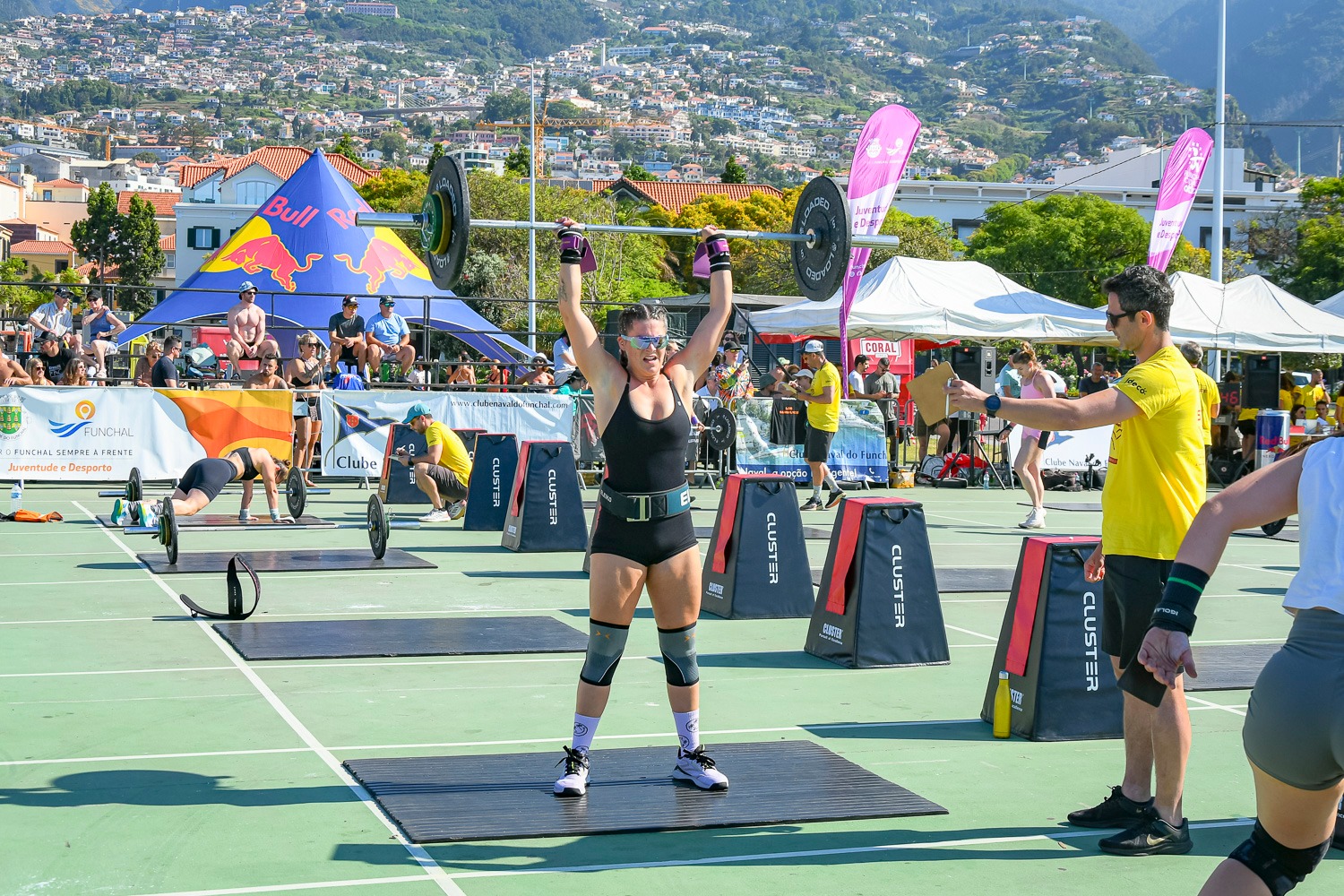 Female athlete performing a Squat Snatch during a Madeira Games 2025 workout, showcasing strength and precision.