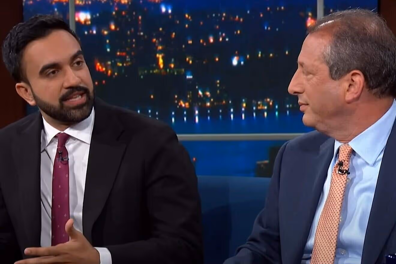 Close-up of Zohran Mamdani and Brad Lander on Stephen Colbert's talk show